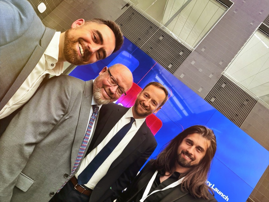 Dalibor Mráz with guests at a conference