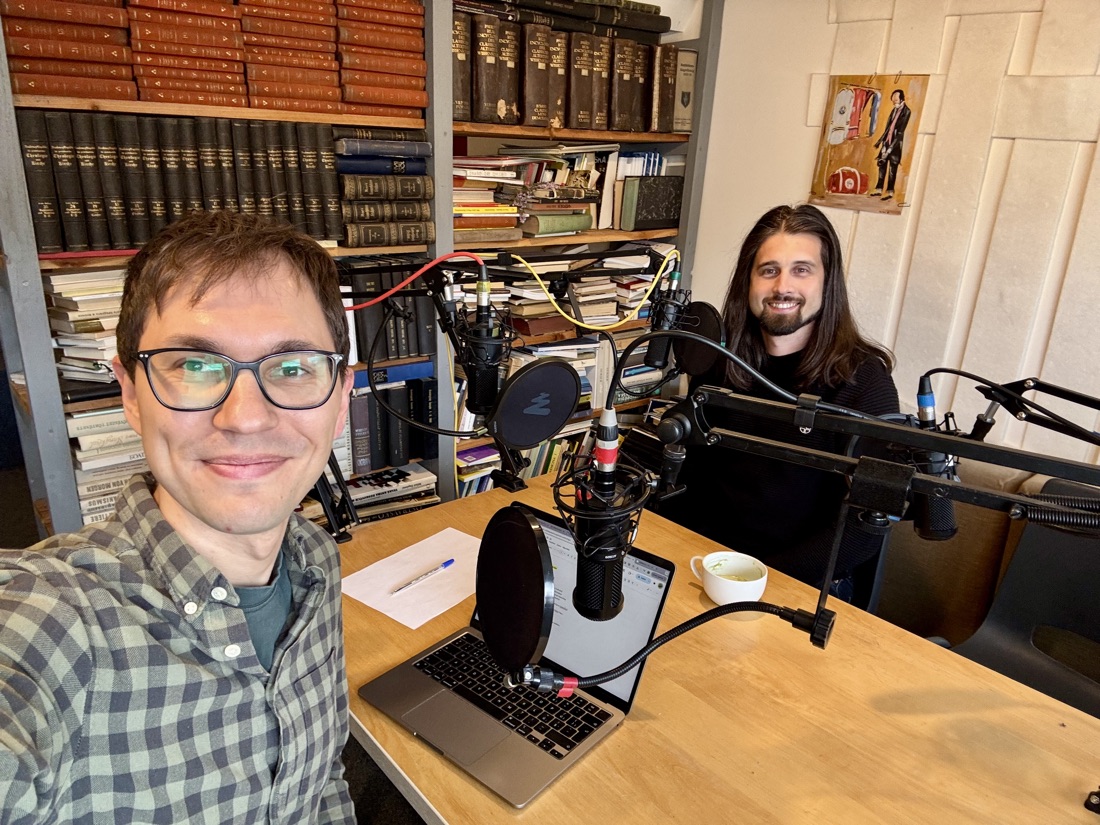 Podcast recording, two speakers at microphones