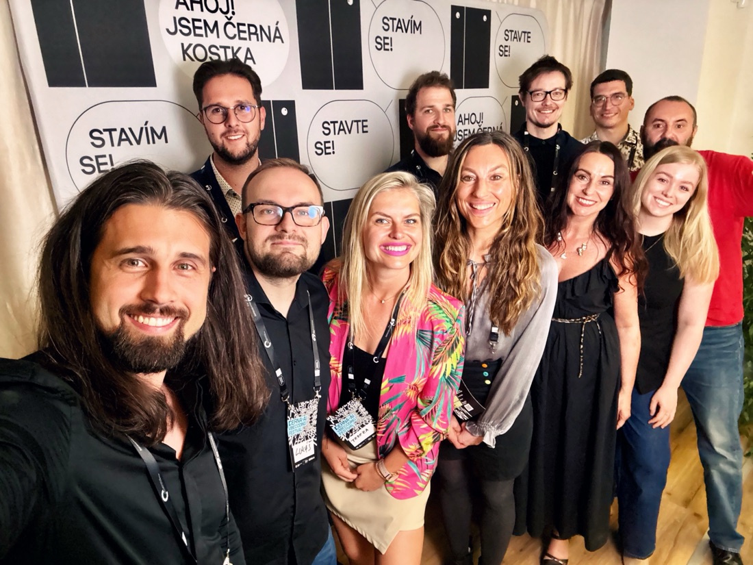 ČERNÁ.AI team in front of the Černá kostka installation