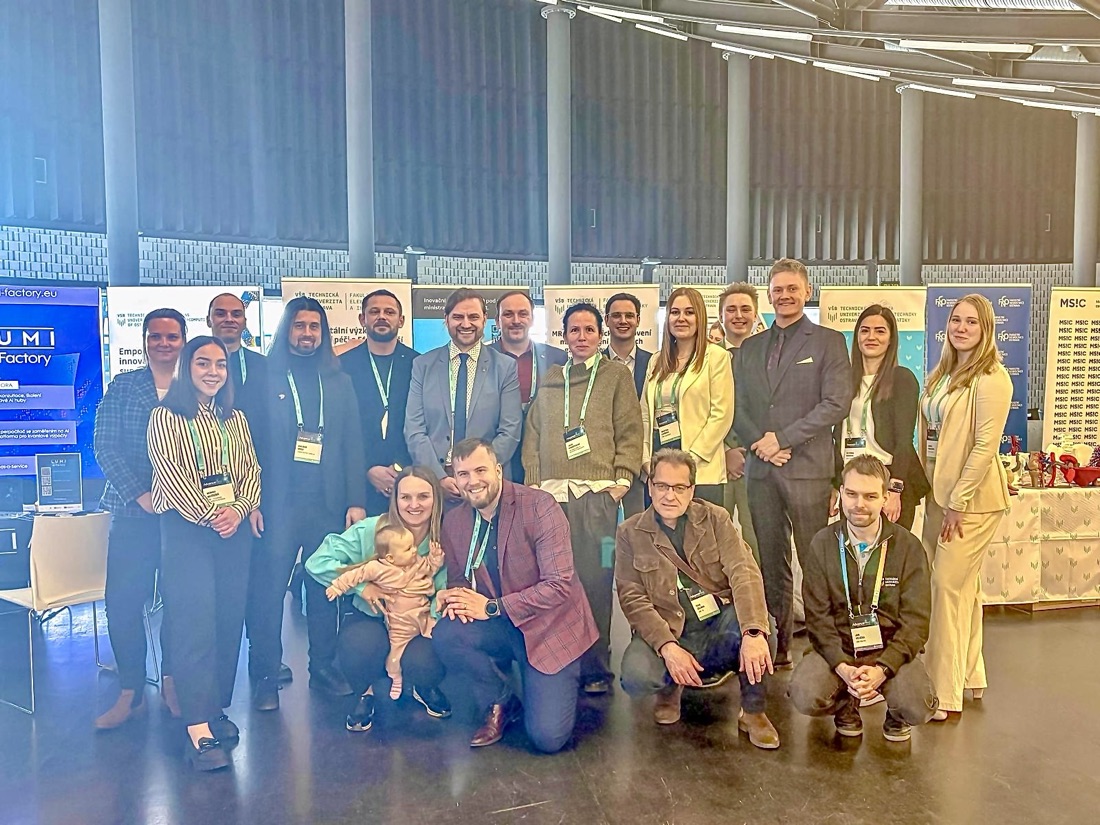Group photo of AI conference attendees